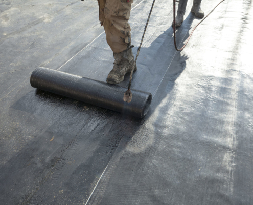 waterproofing roll bituminous material in the trench. constructi